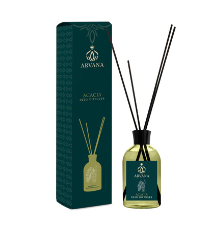 Arvana Acacia Reed Diffuser in a clear glass bottle with black reeds and a dark green box.
