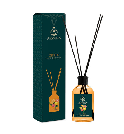 Arvana Citrus Reed Diffuser in a clear glass bottle with black reeds and a dark teal box featuring citrus fruit illustrations.